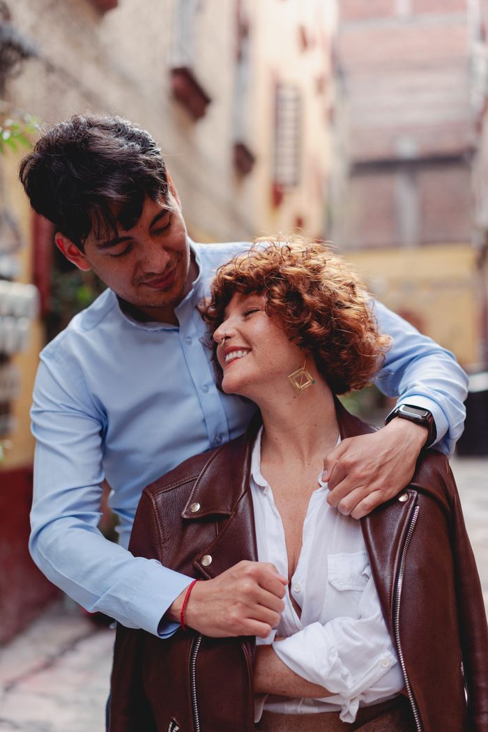 Services man-putting-a-jacket-to-a-woman-8836272